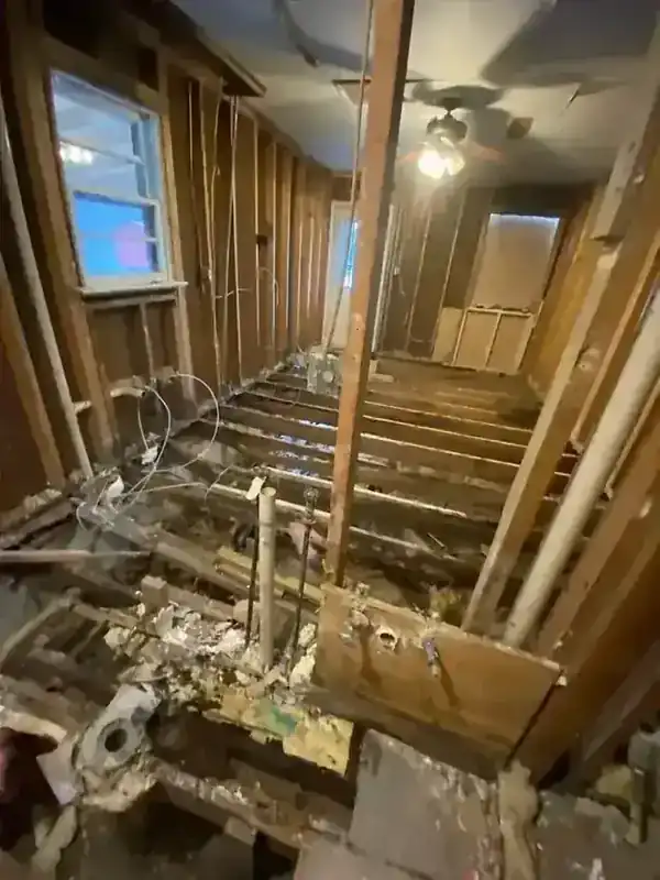 The stripped interior of a Richmond house down to joists and studs after a light demolition clearout